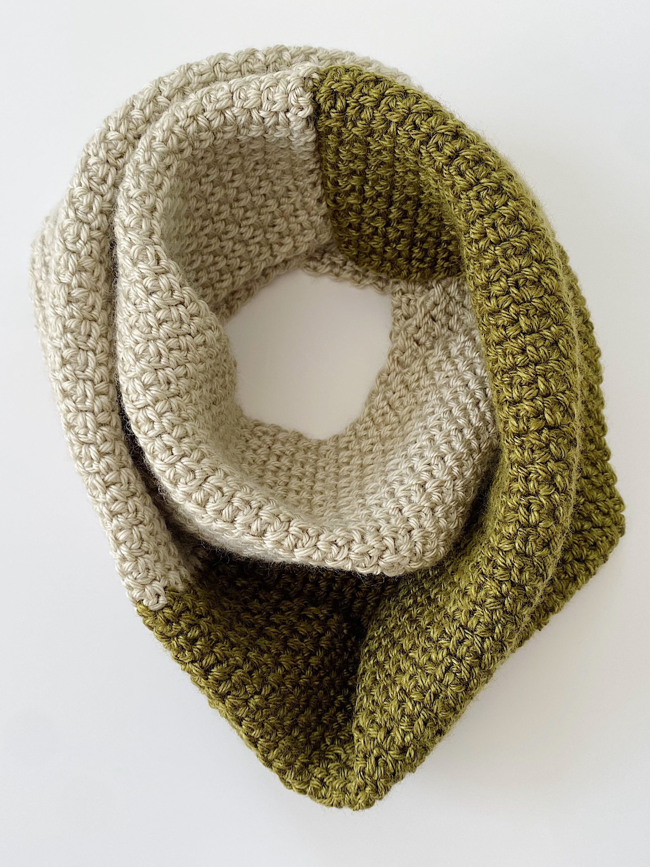 A green and silver infinity scarf.